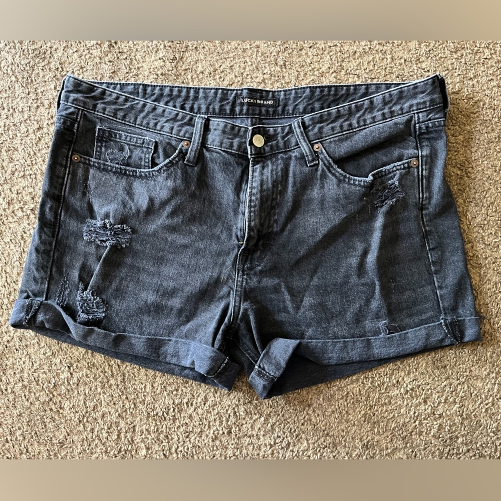 Distressed black jean shorts